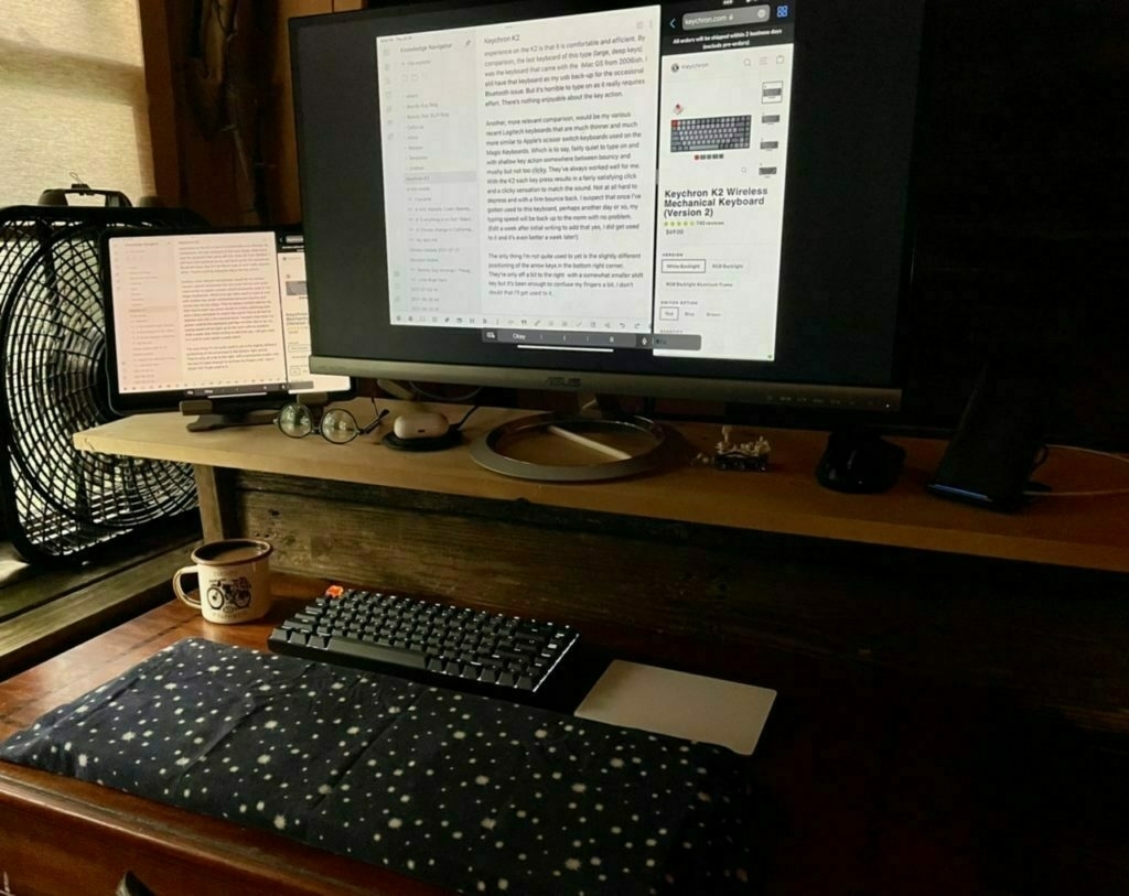 A desk with a monitor and keyboard