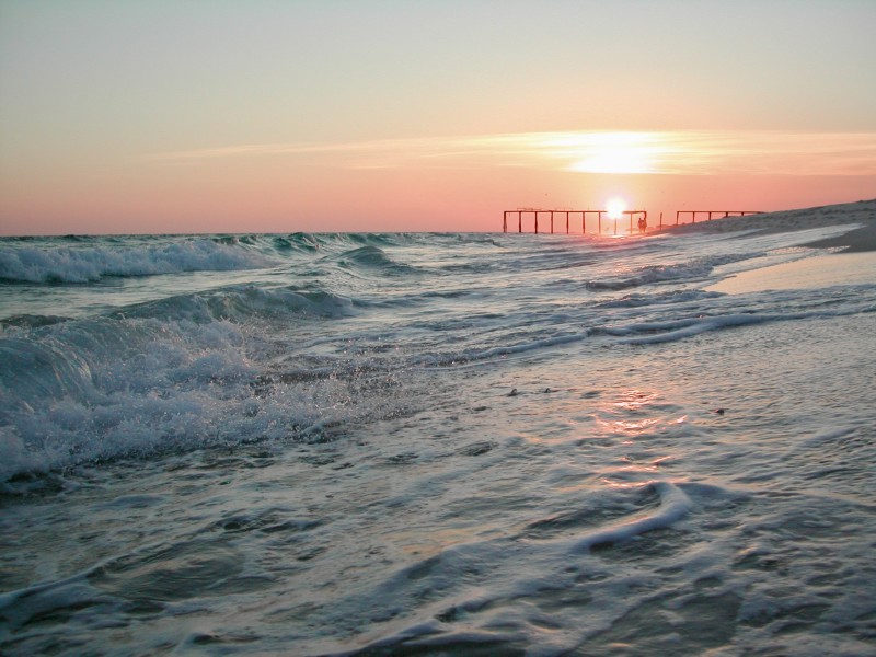 Sunset over the beach and pier